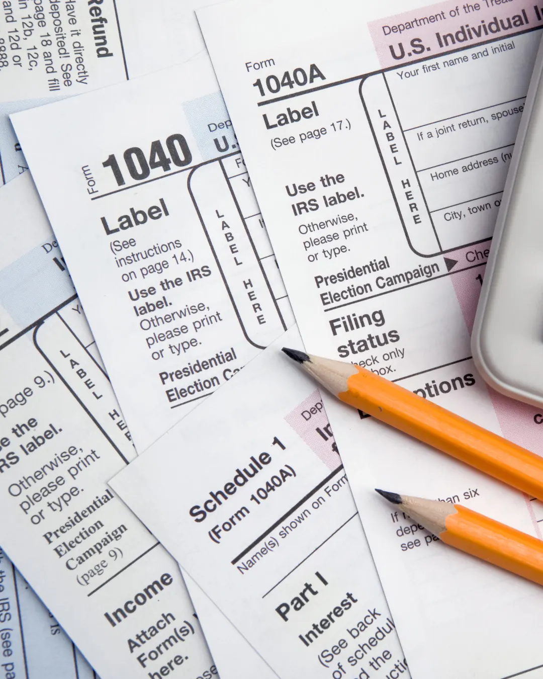 US Form 1040 pages on a desk