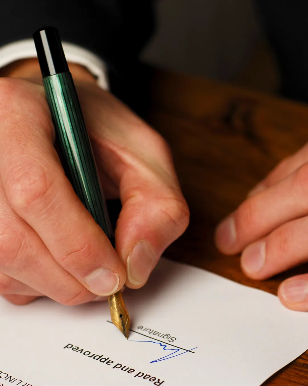 Signing a document with a fountain pen